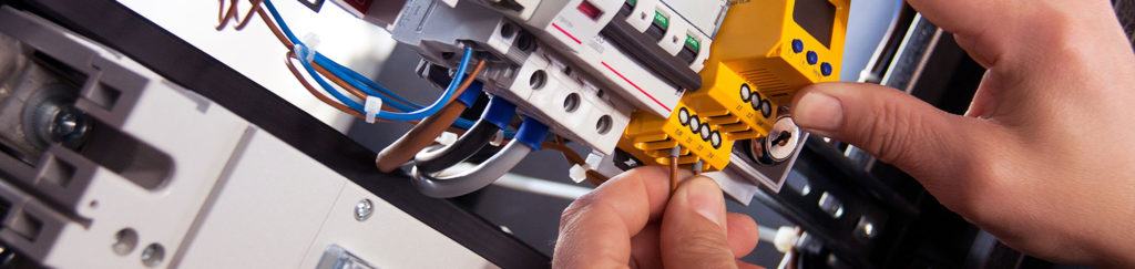 An electrician installing an electric timer