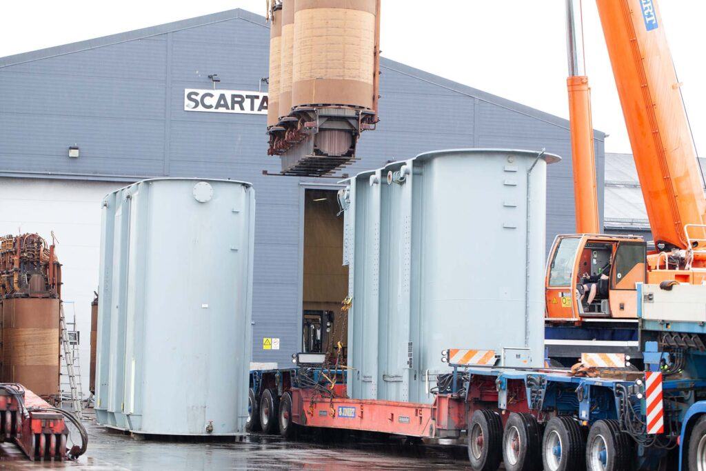 Scartab building and a truck collecting cargo